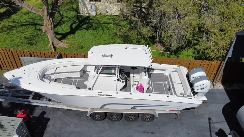 The Image of 2018 Fountain 34 CC boat on a trailer, aerial view. - 0