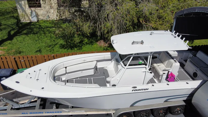 Slide: The Image of 2018 Fountain 34 CC boat on a trailer, aerial view. - 1