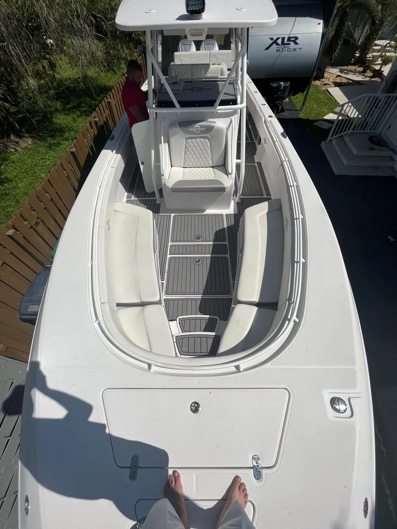 Slide: The Image of 2018 Fountain 34 CC boat with spacious seating and center console. - 2