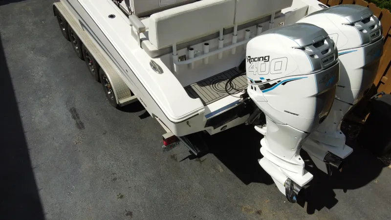 Slide: The Image of 2018 Fountain 34 CC boat with twin Racing 400 outboard engines on a trailer. - 22