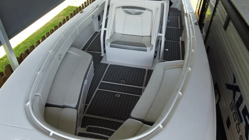 Slide: The Image of 2018 Fountain 34 CC boat interior with cushioned seating and non-slip flooring. - 27
