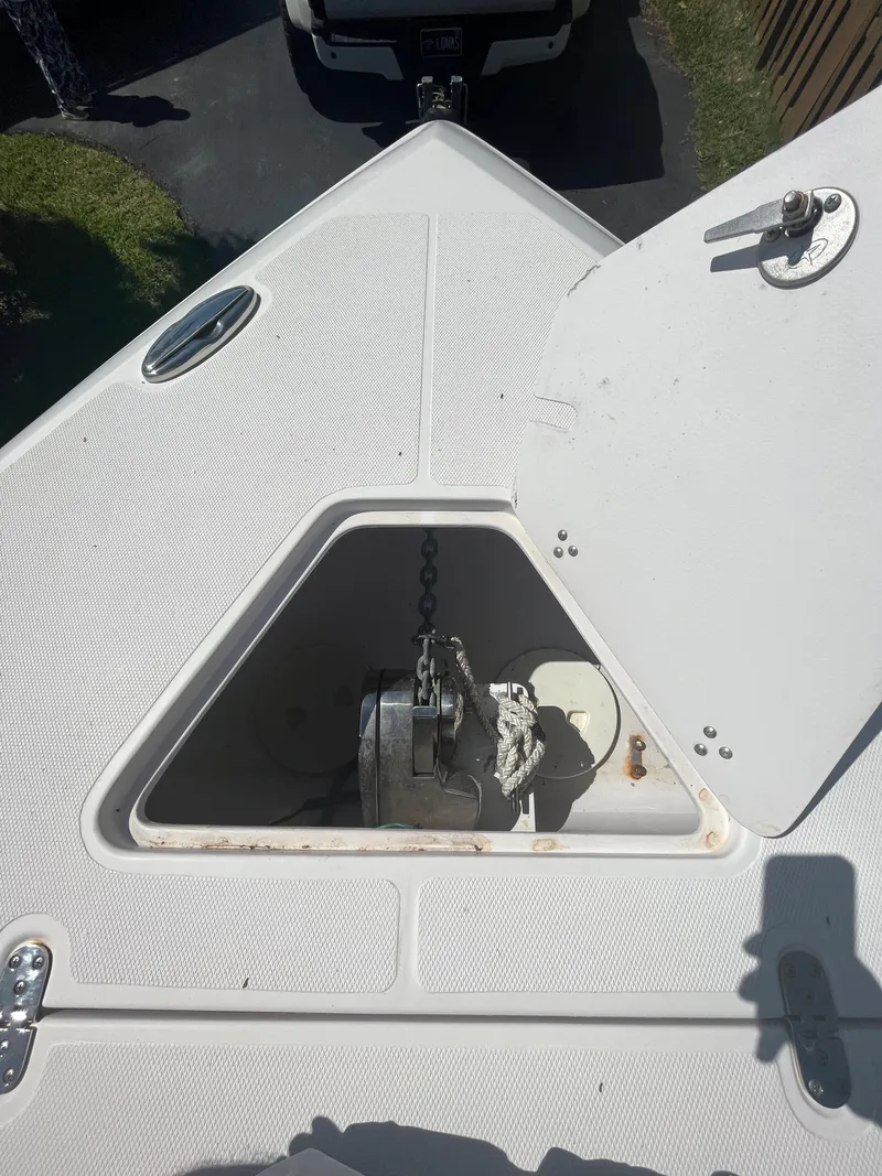 Slide: The Image of 2018 Fountain 34 CC boat anchor compartment with open hatch. - 7