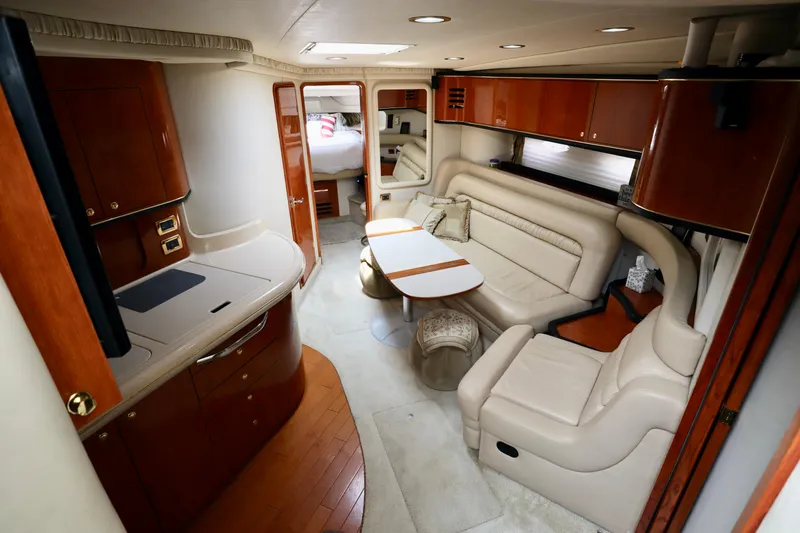Slide: The Image of Luxurious interior of a 2001 Sea Ray 460 Sundancer yacht with elegant seating and cabinetry. - 14