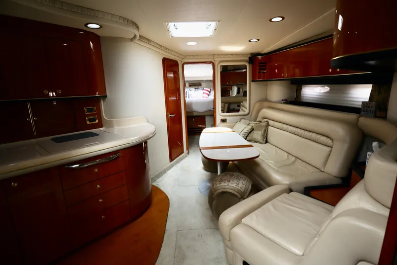 Slide: The Image of Luxurious interior of 2001 Sea Ray 460 Sundancer yacht with elegant seating and cabinetry. - 19