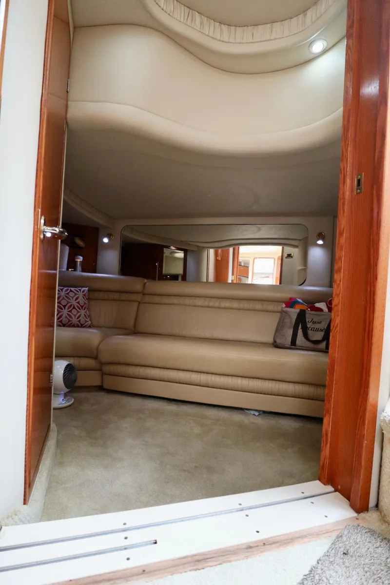 Slide: The Image of Luxurious interior of 2001 Sea Ray 460 Sundancer yacht with beige leather seating. - 20