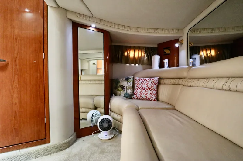 Slide: The Image of Interior of 2001 Sea Ray 460 Sundancer yacht with beige seating and decorative pillows. - 22
