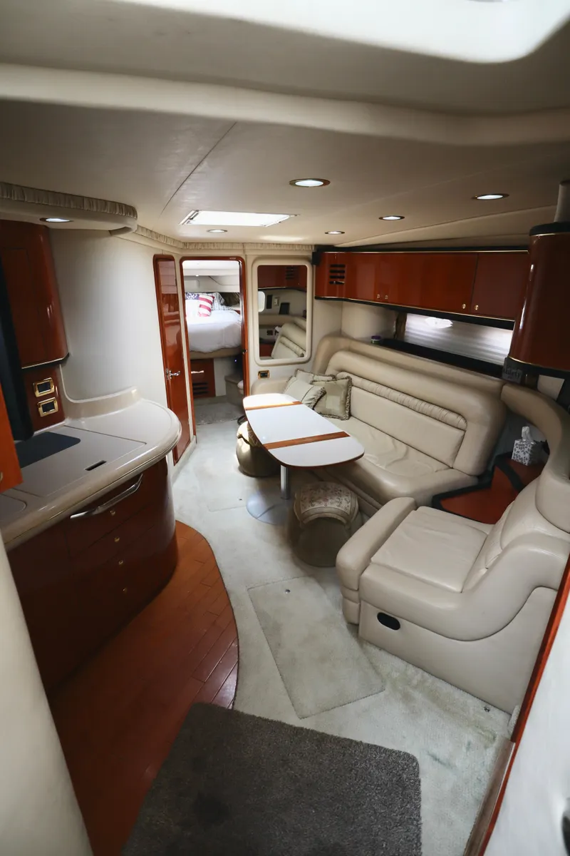 Slide: The Image of Luxurious interior of 2001 Sea Ray 460 Sundancer yacht with plush seating and elegant design. - 28