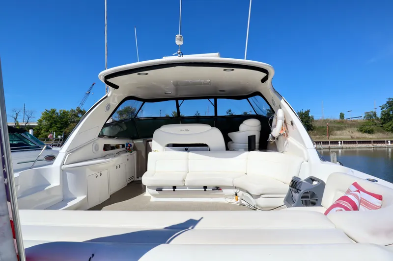 Slide: The Image of 2001 Sea Ray 460 Sundancer yacht with spacious white seating and open deck. - 3