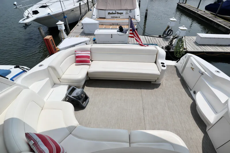 Slide: The Image of Luxurious 2001 Sea Ray 460 Sundancer yacht with spacious seating and elegant design at the dock. - 32