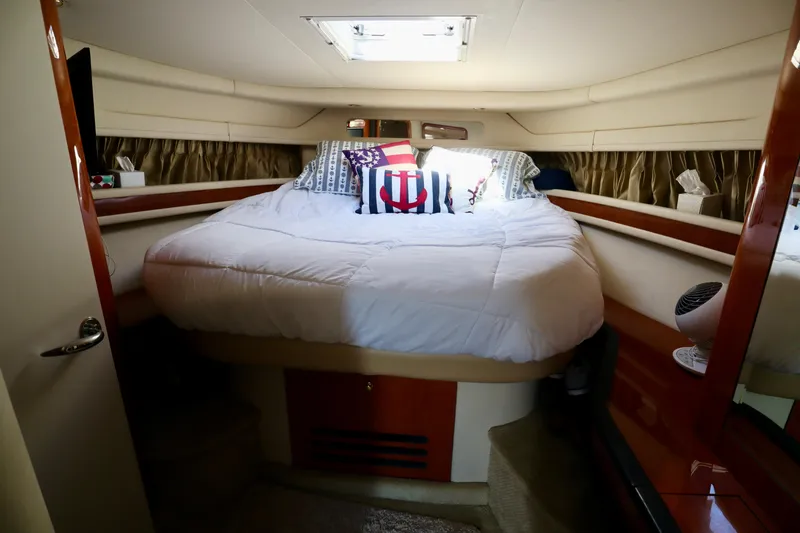 Slide: The Image of Luxurious cabin interior of 2001 Sea Ray 460 Sundancer yacht with cozy bedding. - 33
