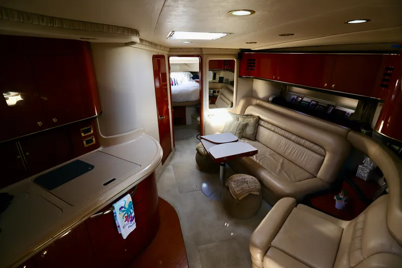 Slide: The Image of Luxurious interior of 2001 Sea Ray 460 Sundancer yacht with leather seating and modern amenities. - 34