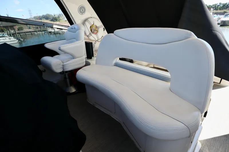 Slide: The Image of Interior seating of 2001 Sea Ray 460 Sundancer yacht, featuring white leather upholstery. - 39