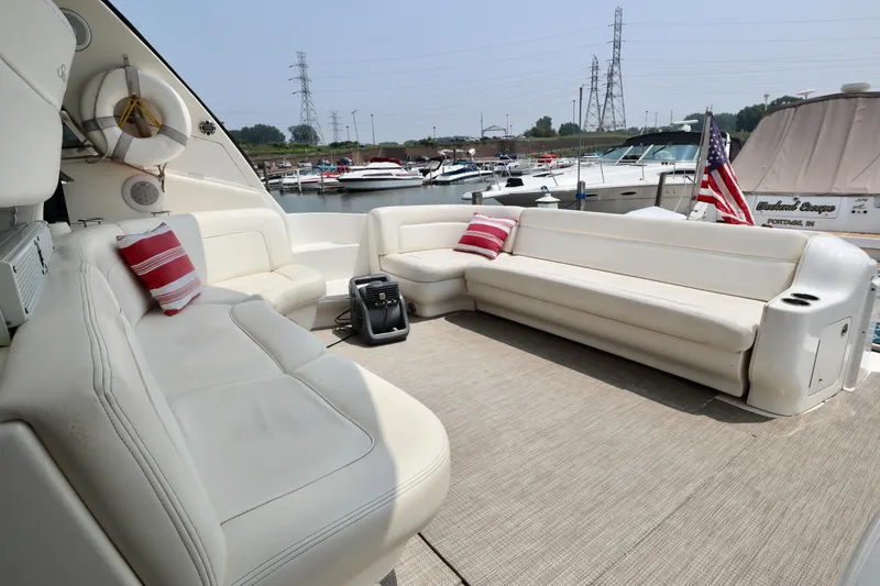Slide: The Image of Luxurious 2001 Sea Ray 460 Sundancer yacht with spacious seating and marina view. - 6