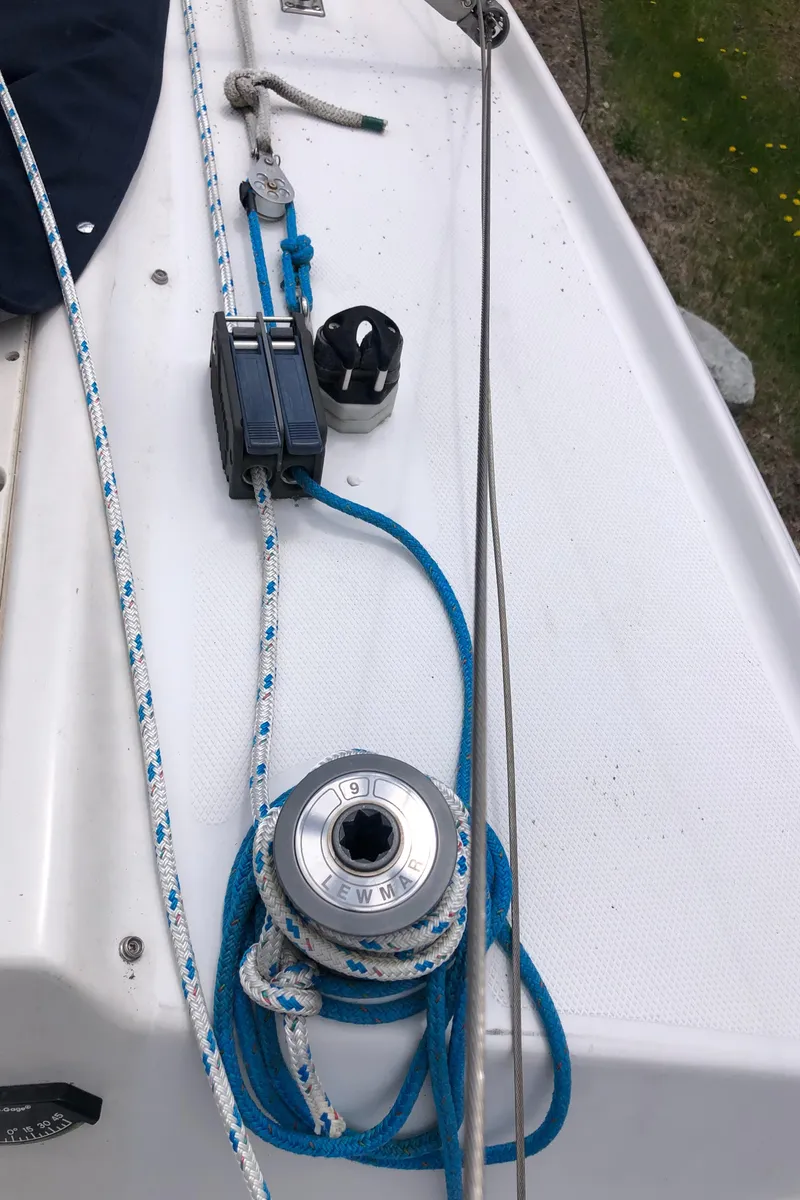 Slide: The Image of Deck of 1998 Hunter 240 sailboat with ropes and winch. - 27