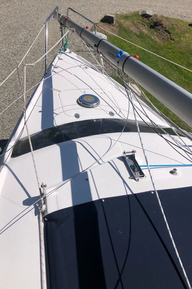 Slide: The Image of Sailboat deck of a 1998 Hunter 240 with visible rigging and mast. - 3