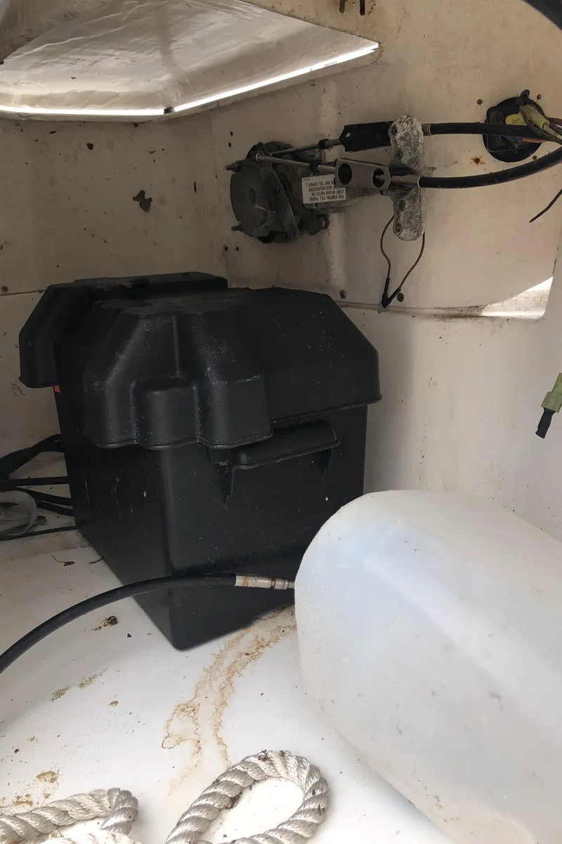 Slide: The Image of Interior of a 1998 Hunter 240 boat showing battery compartment and wiring. - 30
