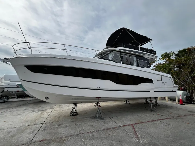 Slide: The Image of 2024 Jeanneau NC Weekender 1295 Fly on stands, side view. - 0
