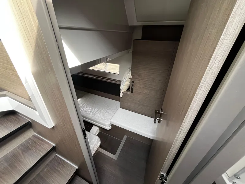 Slide: The Image of 2024 Jeanneau NC Weekender 1295 Fly cabin interior with modern design. - 21