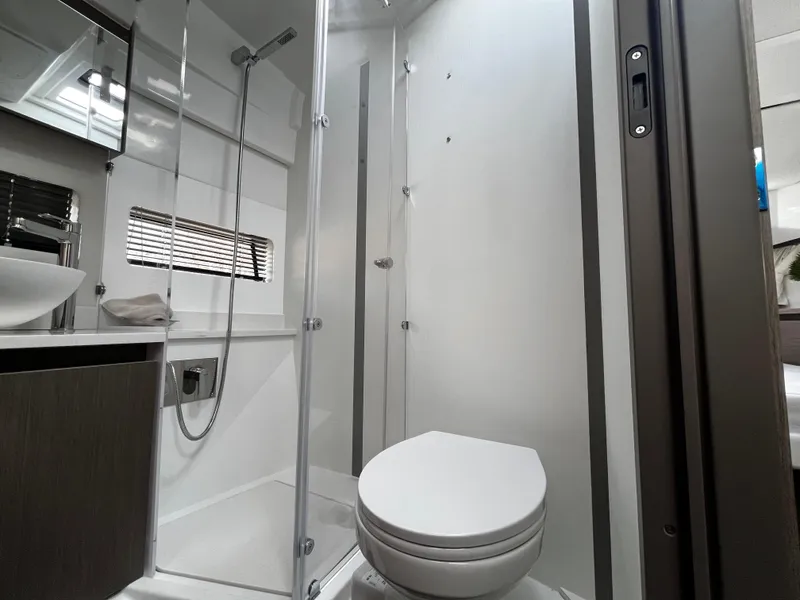 Slide: The Image of 2024 Jeanneau NC Weekender 1295 Fly bathroom with shower and toilet. - 25