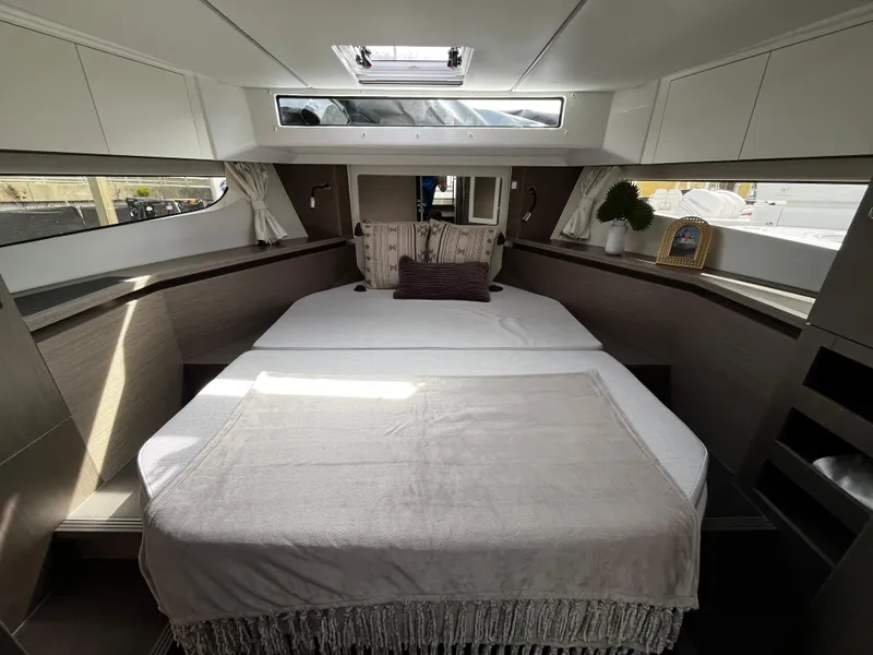 Slide: The Image of 2024 Jeanneau NC Weekender 1295 Fly cabin interior with bed and skylight. - 26