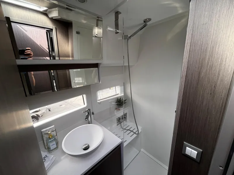 Slide: The Image of 2024 Jeanneau NC Weekender 1295 Fly bathroom with modern fixtures and sleek design. - 29