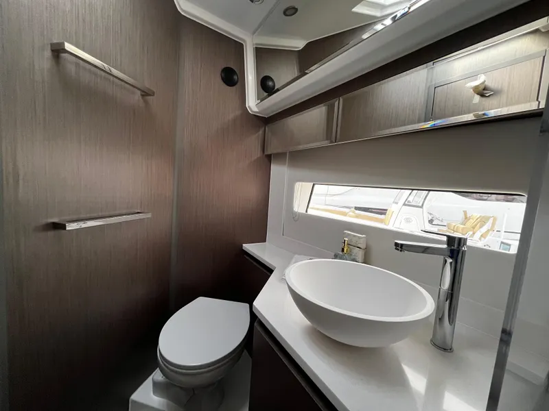 Slide: The Image of 2024 Jeanneau NC Weekender 1295 Fly bathroom with modern fixtures and sleek design. - 30