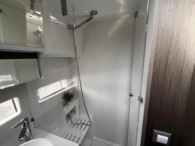 Slide: The Image of 2024 Jeanneau NC Weekender 1295 Fly bathroom with modern fixtures and shower. - 31