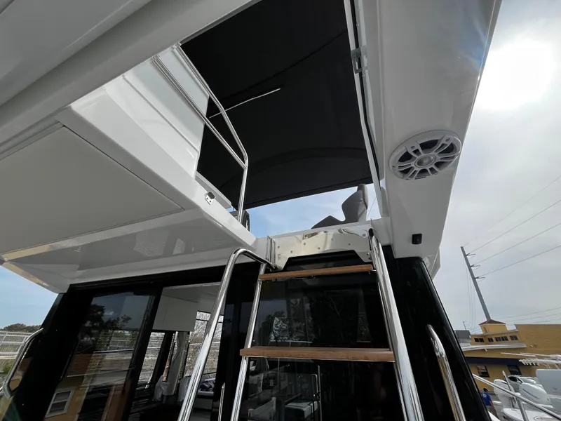 Slide: The Image of 2024 Jeanneau NC Weekender 1295 Fly, view of flybridge and ladder. - 34