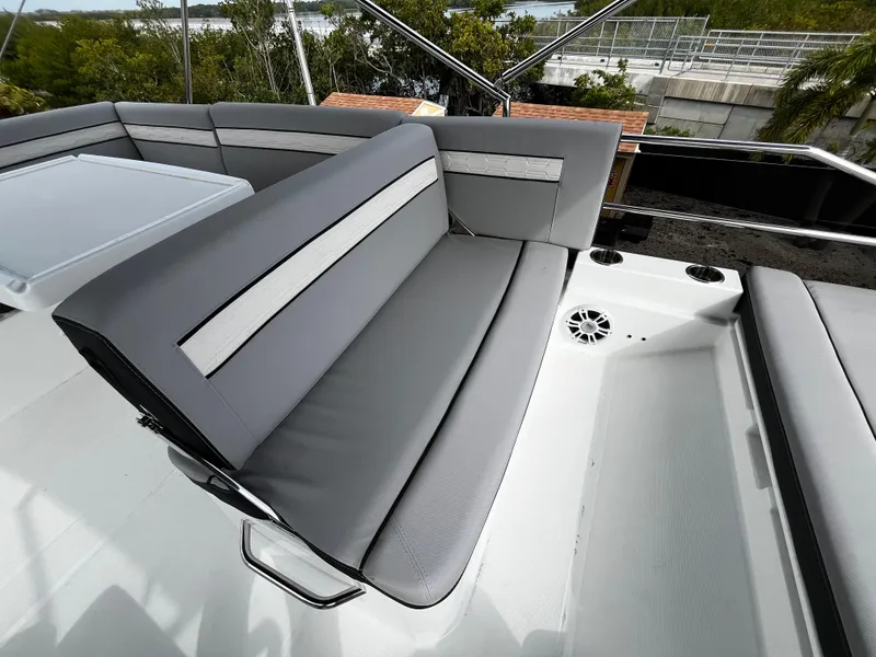 Slide: The Image of 2024 Jeanneau NC Weekender 1295 Fly, grey cushioned seating area on deck. - 37