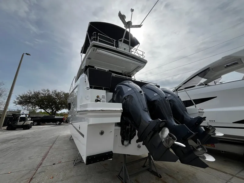 Slide: The Image of 2024 Jeanneau NC Weekender 1295 Fly with triple outboard motors. - 5