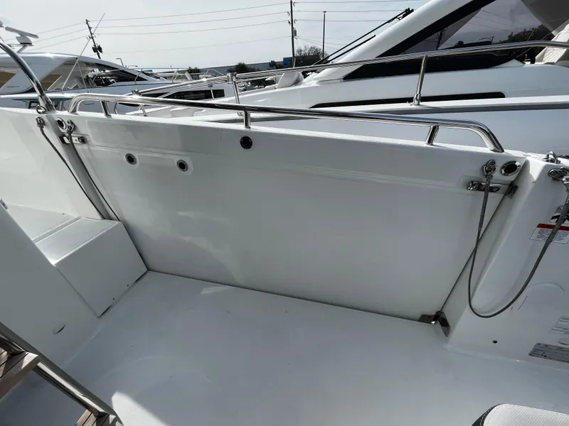 Slide: The Image of 2024 Jeanneau NC Weekender 1295 Fly deck area with stainless steel railings. - 8