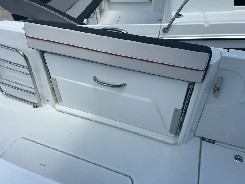 Slide: The Image of 2024 Jeanneau Leader 10.5 CC boat interior storage compartment. - 10