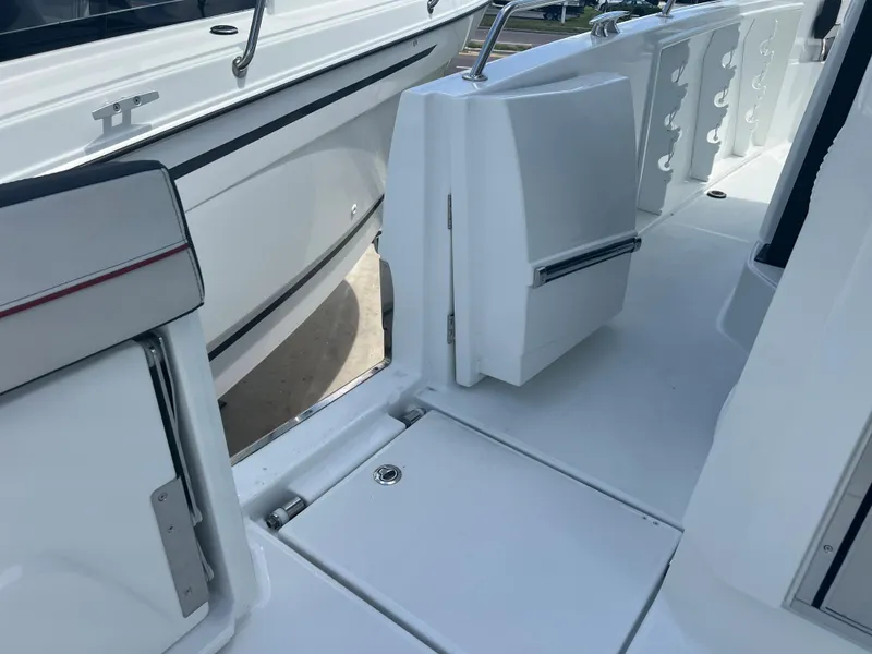 Slide: The Image of 2024 Jeanneau Leader 10.5 CC boat interior, featuring sleek white deck and modern design. - 12