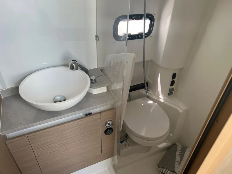 Slide: The Image of 2024 Jeanneau Leader 10.5 CC bathroom with modern sink and toilet. - 21