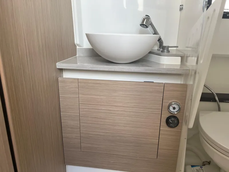 Slide: The Image of Modern bathroom sink and cabinet in 2024 Jeanneau Leader 10.5 CC boat. - 23