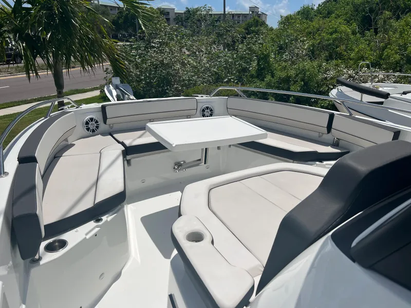 Slide: The Image of 2024 Jeanneau Leader 10.5 CC boat with spacious seating and table. - 25