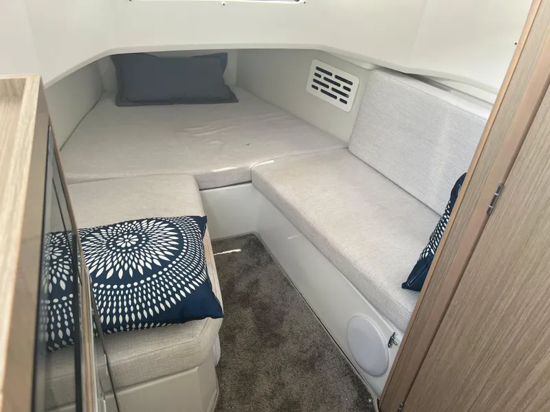 Slide: The Image of 2024 Jeanneau Leader 10.5 CC cabin interior with cozy bedding and modern design. - 26