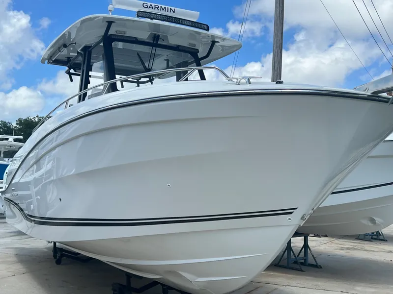 Slide: The Image of 2024 Jeanneau Leader 10.5 CC boat with Garmin equipment on display. - 27