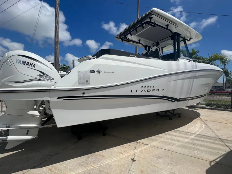 Slide: The Image of 2024 Jeanneau Leader 10.5 CC boat with Yamaha engines on display. - 4