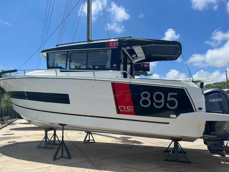 Slide: The Image of 2026 Jeanneau NC Sport 895 cruising on open water, showcasing sleek design and performance. - 0