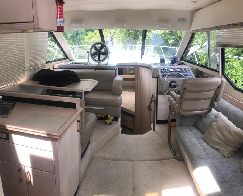 Slide: The Image of Interior of 1996 Bayliner 3587 Motoryacht with seating, helm, and kitchenette. - 20