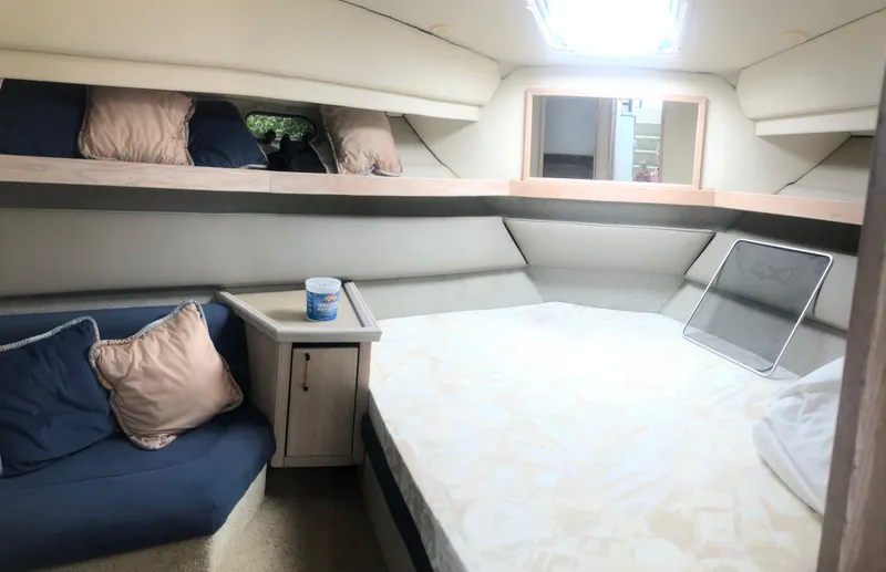 Slide: The Image of 1996 Bayliner 3587 Motoryacht interior cabin with bed, seating, and storage. - 27