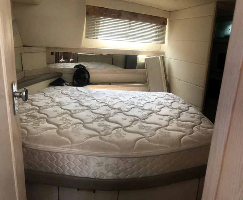 Slide: The Image of 1996 Bayliner 3587 Motoryacht interior cabin with bed, mirror, and window blinds. - 39