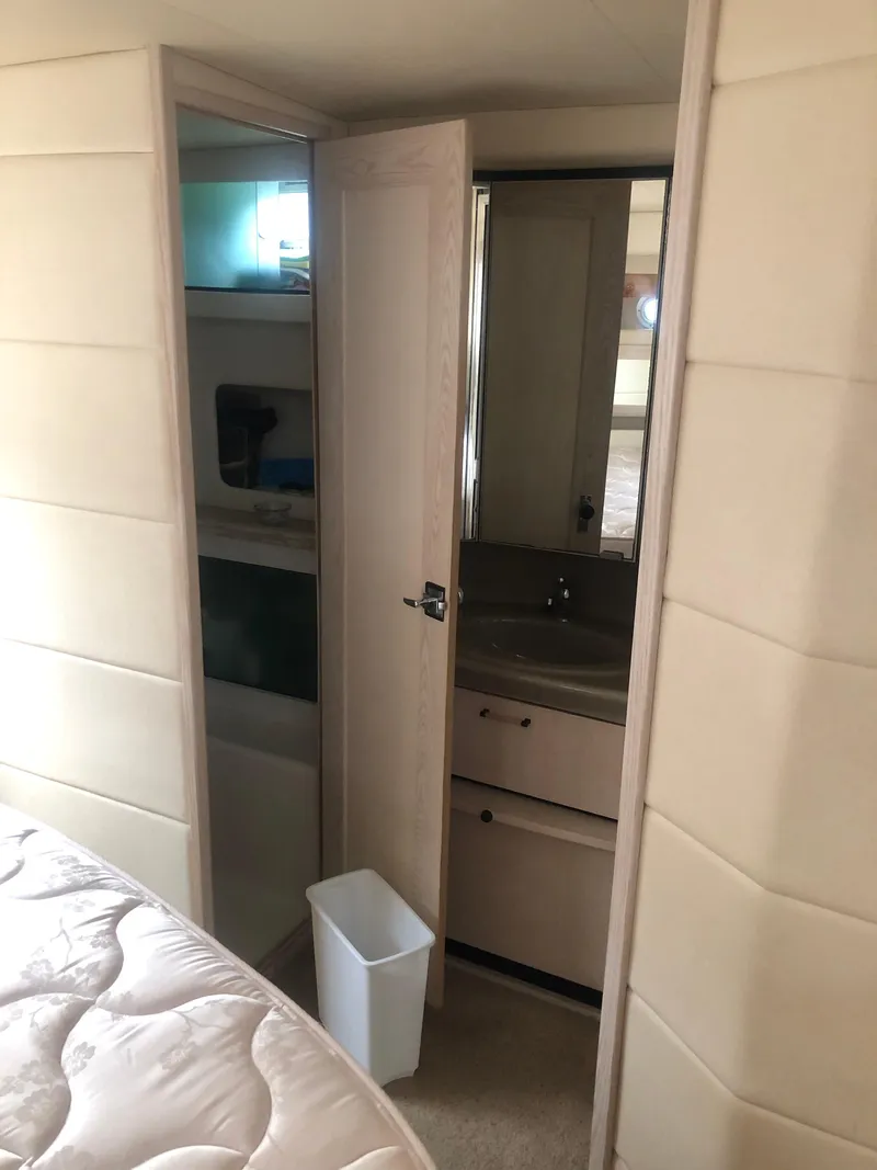 Slide: The Image of Interior of 1996 Bayliner 3587 Motoryacht with bathroom and storage area. - 42