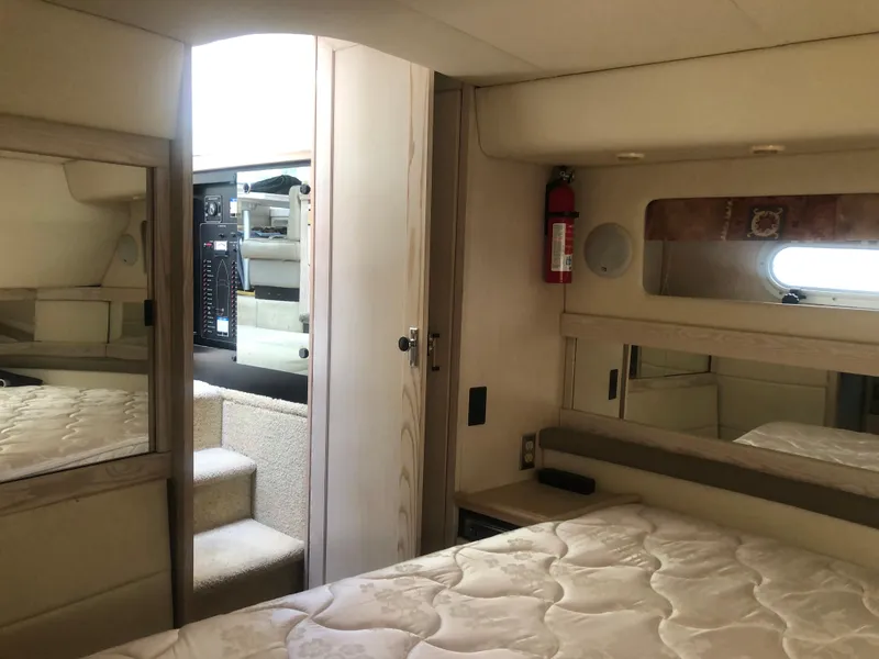 Slide: The Image of Interior of 1996 Bayliner 3587 Motoryacht with bed, mirrors, and stairs. - 45