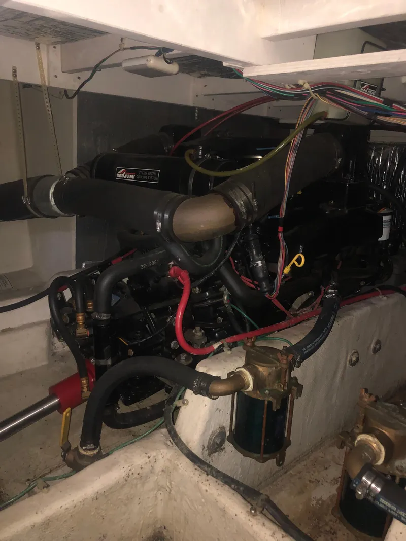 Slide: The Image of Engine room of 1996 Bayliner 3587 Motoryacht with visible wiring and components. - 49