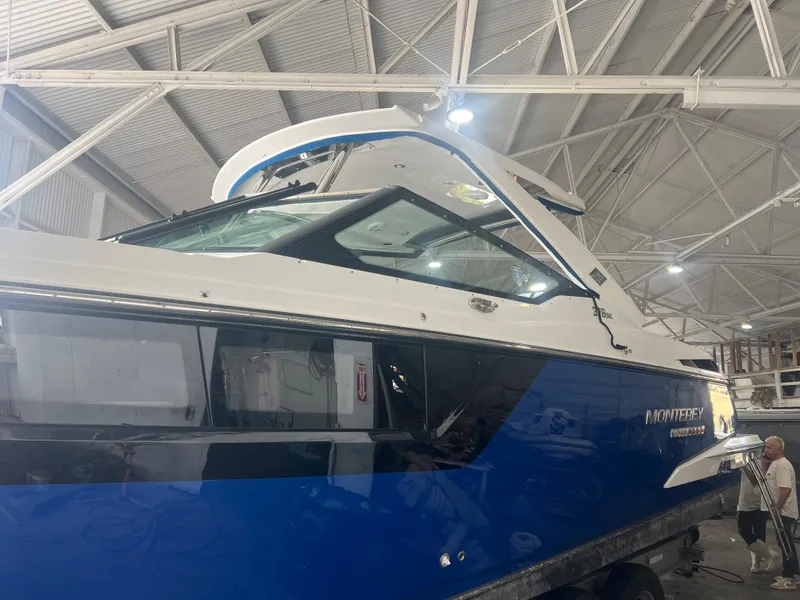 Slide: The Image of 2019 Monterey 378 Super Express boat in a warehouse. - 10