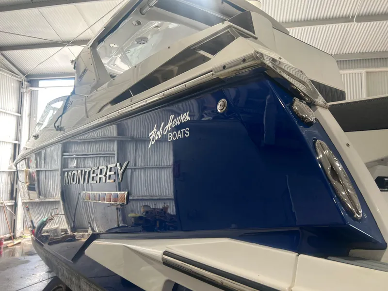 Slide: The Image of 2019 Monterey 378 Super Express boat in a storage facility. - 11