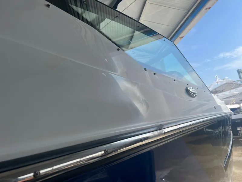 Slide: The Image of 2019 Monterey 378 Super Express boat side view under a canopy. - 14