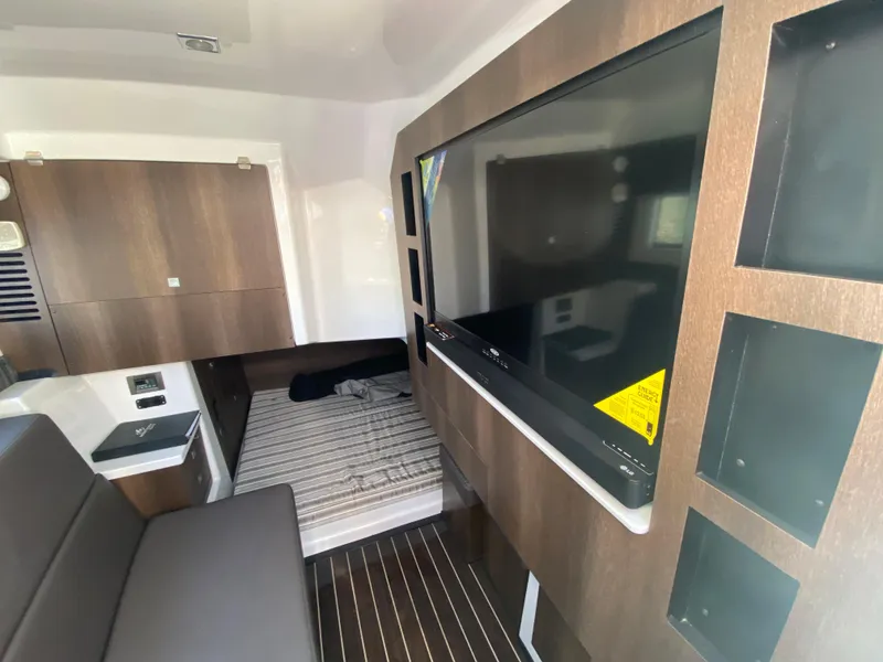 Slide: The Image of Interior cabin of a 2019 Monterey 378 Super Express with TV and bed. - 20